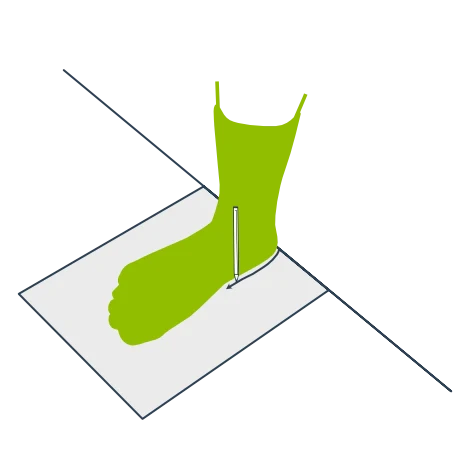 Top view — foot on paper against wall